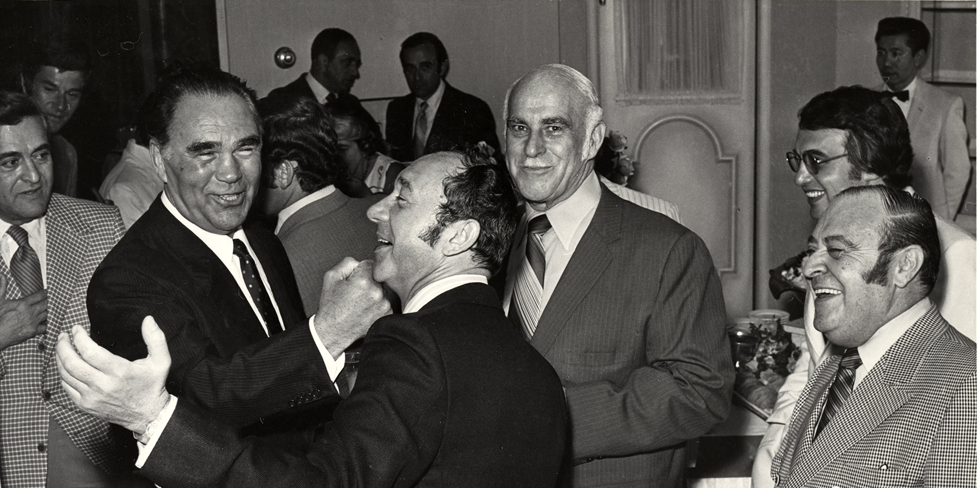 Photograph of Max Goot, Max Schmeling, Henry Kronberg, Harry Levy, Morry Spencer, and unidentified man, at Jewish Federation Luncheon at Caesars Palace, approximately 1970.   --  Henry Kronberg Papers. UNLV Special Collections.