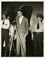 Photograph of Howard Hughes giving a news conference, New York, April, 1947