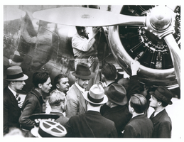 Photograph of Howard Hughes with Lockheed-14 plane, Le Bourget, France, July 11, 1938