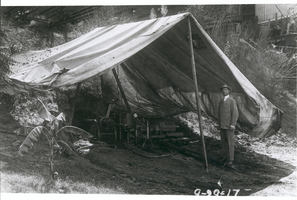 Photograph of Howard R. Hughes, Sr., with trench mining drill, Houston, Texas, September 29, 1917