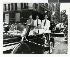Photograph of Howard Hughes in a parade, Houston, Texas, July 30, 1938