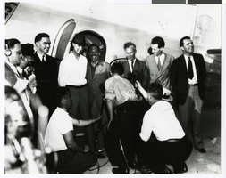 Photograph of Howard Hughes, with Ed Lund, Grover Whalen, Harry Connor, Richard Stoddart, and Lieutenant Thomas Thurlow, July 10, 1938