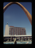 Film transparency of Desert Inn swimming pool and tower, framed by arch, Las Vegas, circa 1967-1972