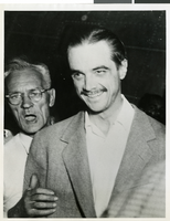 Photograph of Howard Hughes after the landing of the second XF-11, 1947