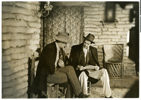 Photograph of Howard Hughes with Walter Huston on the set of The Outlaw, Hollywood, circa 1941