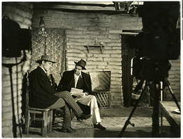 Photograph of Howard Hughes with Walter Huston on the set of The Outlaw, Hollywood, circa 1941