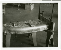 Photograph of an airplane part during assembly, circa 1920s-1950s