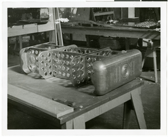 Photograph of an airplane part during assembly, circa 1920s-1950s