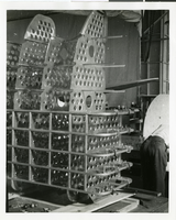 Photograph of an airplane part during assembly, circa 1920s-1950s