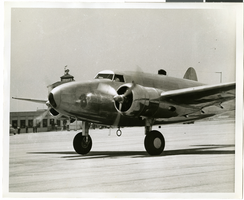 Photograph of Howard Hughes and the Lockheed 14, July 3, 1938