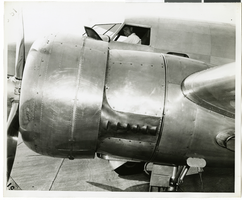 Photograph of Howard Hughes in his Lockheed 14 aircraft, 1938