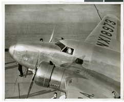 Photograph of Howard Hughes in his Lockheed 14 aircraft, Floyd Bennett Field, New York, 1938