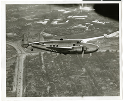 Photograph of the Lockheed 14 aircraft over New York City, July 1938