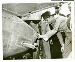 Photograph of Howard Hughes behind his plane at Le Bourget Airfield, France, July 1938