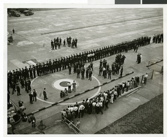 Photograph of the arrival of Howard Hughes at Floyd Bennett Airport, New York, July 14, 2013