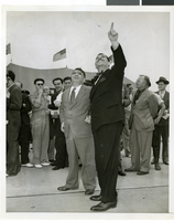 Photograph a crowd awaiting watching Howard Hughes land, New York, July 14, 2013