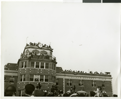 Photograph of a crowd awaiting the arrival of Howard Hughes, New York, July 14, 1938