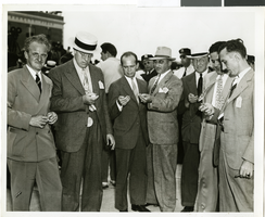 Photograph of a crowd of people awaiting the arrival of Howard Hughes, New York, July 14, 1938
