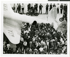 Photograph of Howard Hughes and crowds at Floyd Bennett Airfield, New York, July 14, 1938