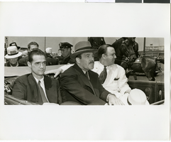 Photograph of Howard Hughes and crew at a parade, New York, July 15, 1938