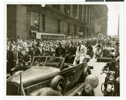 Photograph of Howard Hughes and crew at a parade, New York, July 15, 1938