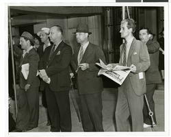 Photograph of Howard Hughes and crew at a parade, New York, July 15, 1938
