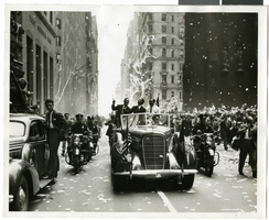Photograph of Howard Hughes and his crew at a parade, New York, July 15, 1938