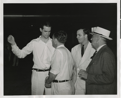Photograph of Howard Hughes talking to an unidentified man, Chicago, 1938