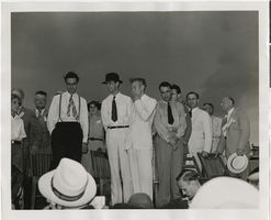Photograph of Howard Hughes standing on stage, Chicago, 1938