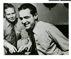 Photograph of Howard Hughes talking to newspapermen, Los Angeles, August 1, 1938