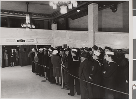 Photograph of people in a line, circa late 1930s
