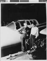 Photograph of airplanes being built by Howard Hughes and workers, circa 1943
