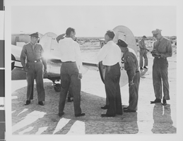 Photograph of Howard Hughes flying a plane, circa 1944