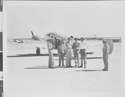 Photograph of Howard Hughes flying a plane, circa 1944