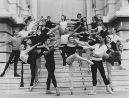 Vassili Sulich and a group of dancers posing on stairs, Monte Carlo, late 1950s