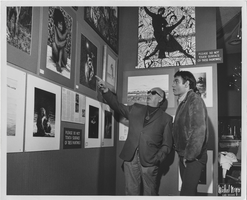Photograph of Vassili Sulich and an unidentified man at an exhibit of Sulich's paintings, Tropicana Hotel, Las Vegas, Nevada, 1960s