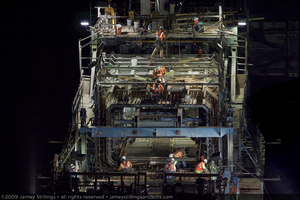 Photograph of ironworkers preparing formwork for pouring concrete during construction of the Mike O'Callaghan-Pat Tillman Memorial Bridge, Nevada border, July 1, 2009