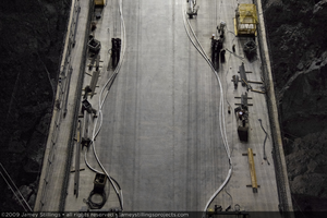 Photograph showing an aerial view of construction of the Mike O'Callaghan-Pat Tillman Memorial Bridge as seen from temporary pylons on the Arizona side of the bridge, July 1, 2009