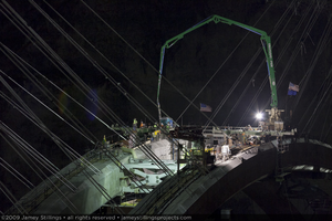 Photograph of the final concrete pour forming the keystone of the arch for the Mike O'Callaghan-Pat Tillman Memorial Bridge between Nevada and Arizona, August 10, 2009
