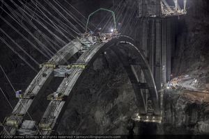 Photograph of the final concrete pour forming the keystone of the arch for the Mike O'Callaghan-Pat Tillman Memorial Bridge between Nevada and Arizona, August 10, 2009