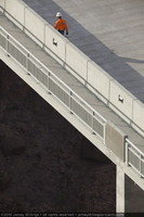 Photograph of a worker crossing the Mike O'Callaghan-Pat Tillman Memorial Bridge at sunrise, Nevada-Arizona border, July 28, 2010