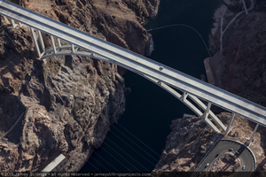 Photograph showing an aerial view of a car driving across the Mike O'Callaghan-Pat Tillman Memorial Bridge, Nevada-Arizona border, January 14, 2011