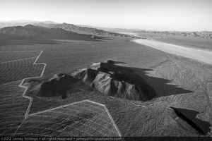 Photograph of Units 2 and 3 skirting the base of a hill rising above alluvial slope with Primm, Nevada to the north, June 2, 2012