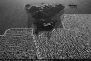 Photograph of hill formation rising above the alluvial slope at the eastern boundaries of Units 2 and 3 with heliostat installation complete, March 21, 2013