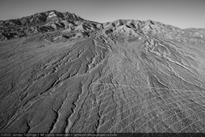 Photograph of natural erosion gullies of alluvial slope overlap, January 6, 2012