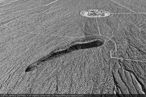 Photograph of construction at Unit 3 with perimeter boundary circumventing hill to the west of project site, January 6, 2012
