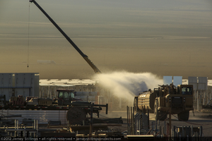 Photograph of dust suppression with water truck, June 4, 2012