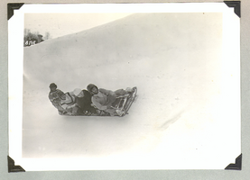 Rex Bell and an unidentified group bobsledding in Europe: photographic print