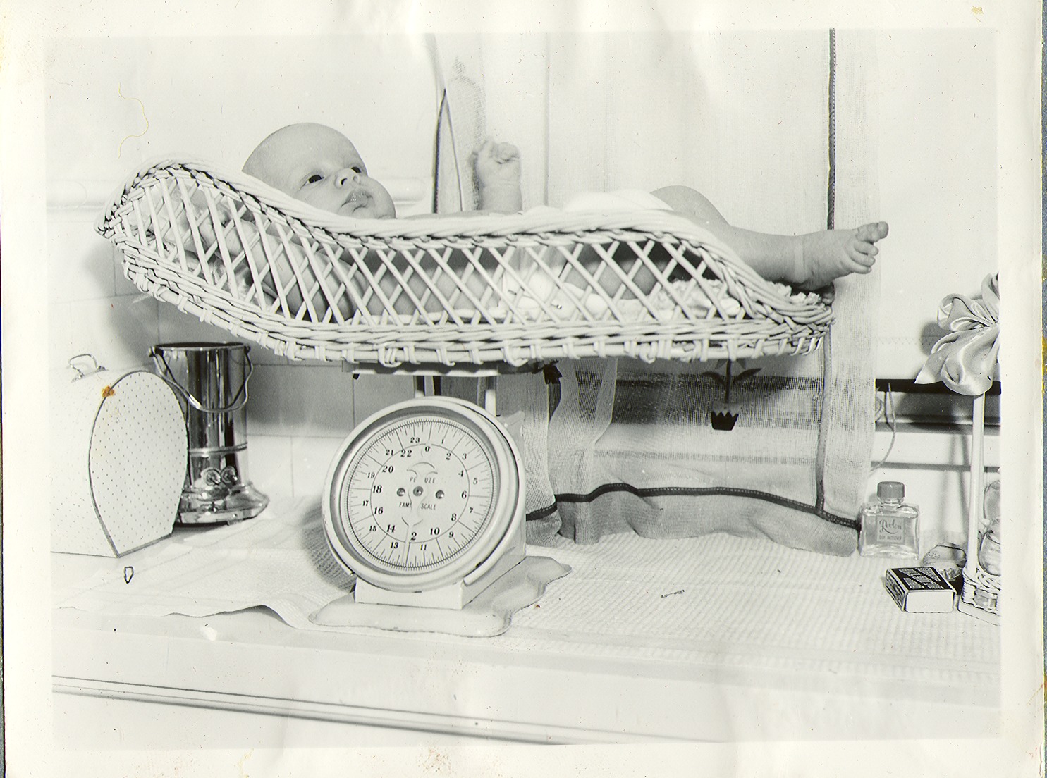 George Francis Robert Bell, age one month. He is on the baby scales: photographic print