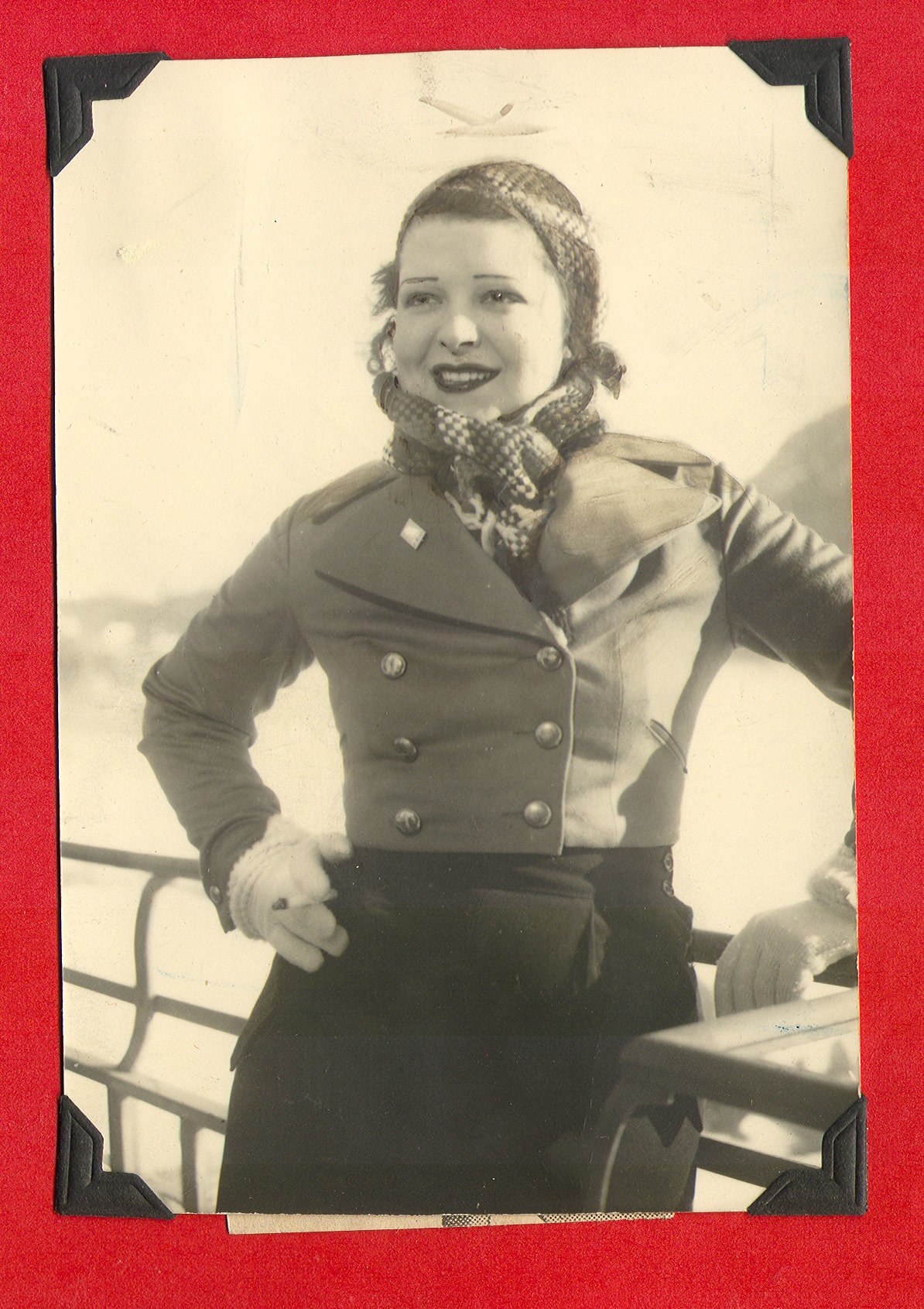 Clara Bow Bell on her honeymoon; standing on the ship near the railing: photographic print
